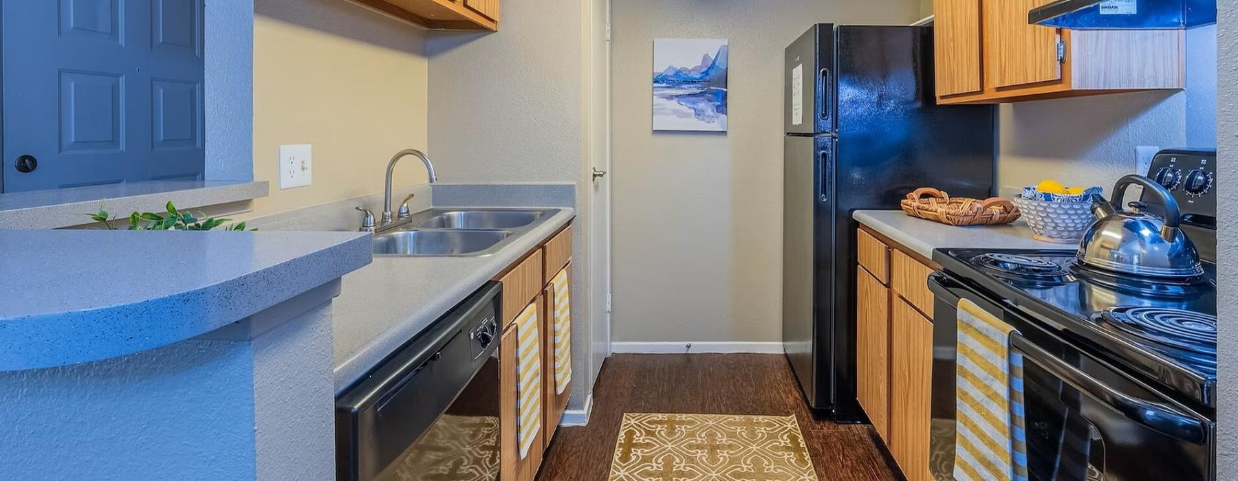 a kitchen with blue cabinets