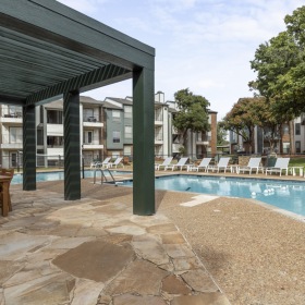 Relax, unwind, and soak up the sun by the resort-style pool — perfect for weekend lounging or gathering with friends under the shaded pergola.